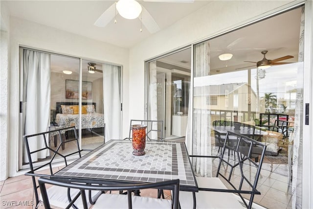 sunroom / solarium with ceiling fan