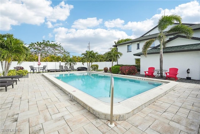 view of pool featuring a patio area