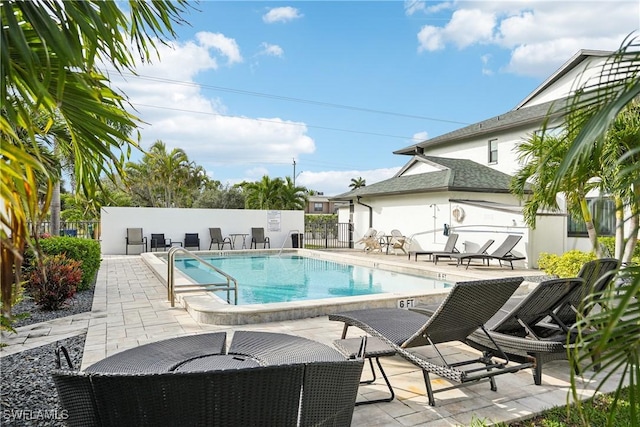 view of swimming pool with a patio area