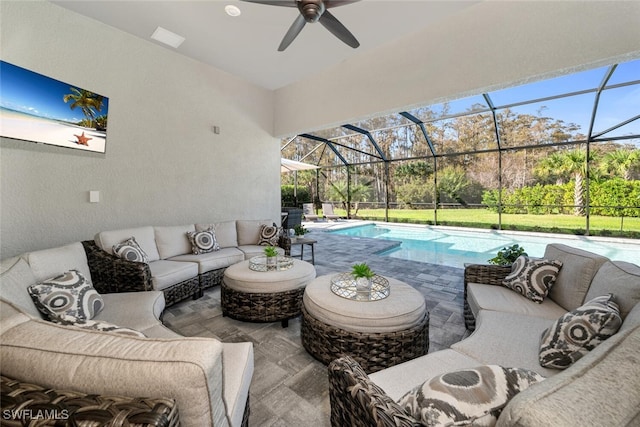 view of patio featuring outdoor lounge area and glass enclosure