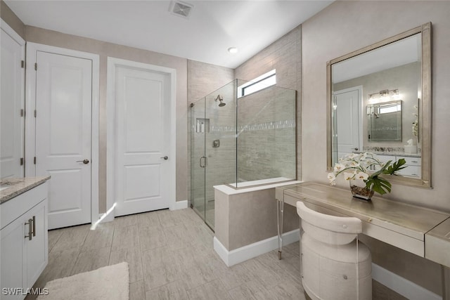 bathroom with vanity and an enclosed shower