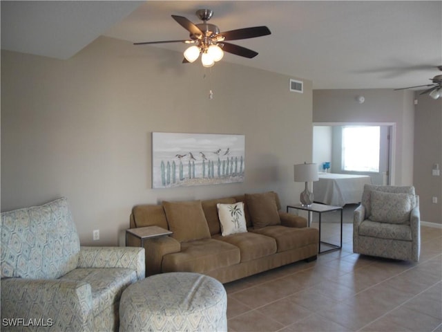 living room with light tile patterned floors and ceiling fan