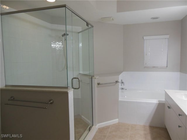 bathroom featuring tile patterned floors, vanity, and independent shower and bath