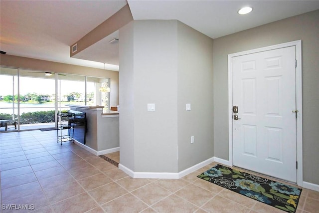 16590 Crownsbury Way Unit 102, Fort Myers, FL 33908 - entryway with light tile patterned flooring, baseboards, and visible vents