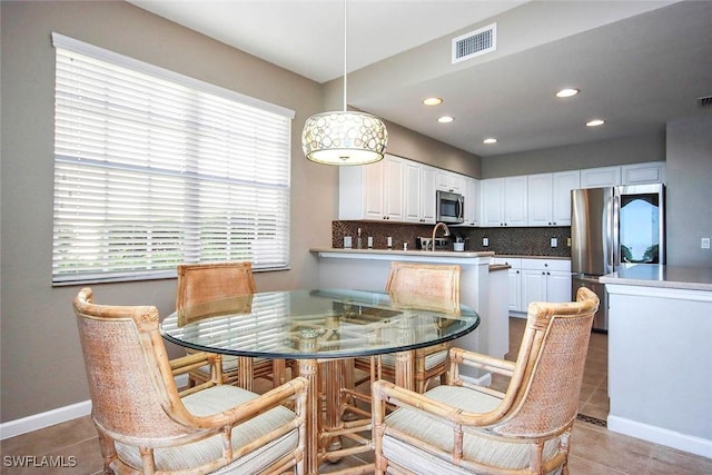 16590 Crownsbury Way Unit 102, Fort Myers, FL 33908 - dining space featuring light tile patterned flooring, baseboards, visible vents, and recessed lighting