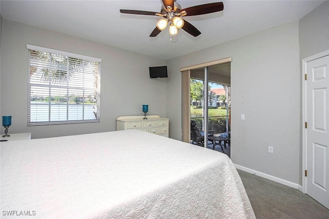 16590 Crownsbury Way Unit 102, Fort Myers, FL 33908 - bedroom featuring multiple windows, carpet floors, baseboards, and access to outside
