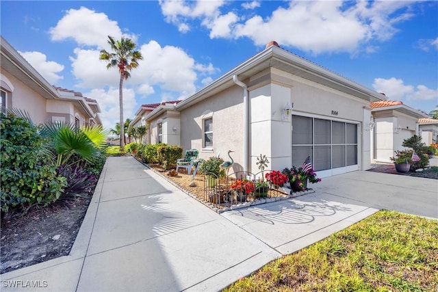 view of side of property with a garage