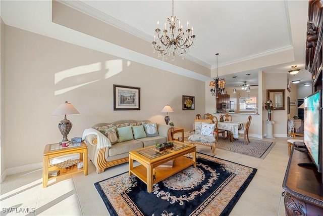 tiled living room with ceiling fan with notable chandelier, a raised ceiling, and ornamental molding