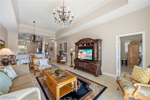 tiled living room with an inviting chandelier, crown molding, and a tray ceiling