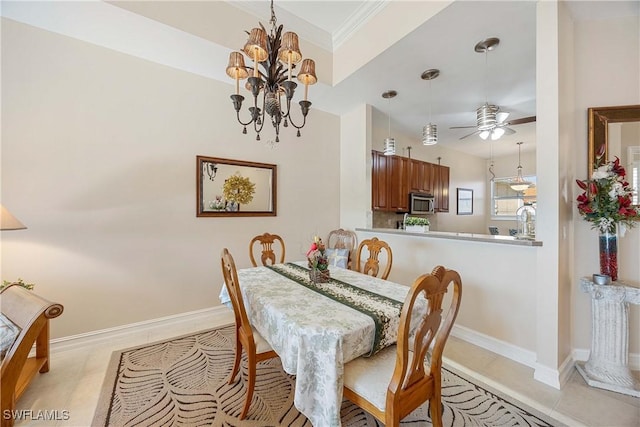 dining area with crown molding, light tile patterned floors, and ceiling fan with notable chandelier