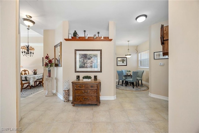 hall featuring an inviting chandelier and light tile patterned flooring