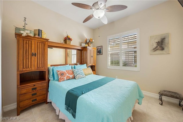 bedroom with ceiling fan and light tile patterned floors