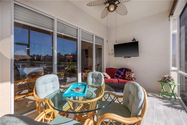 sunroom / solarium with ceiling fan