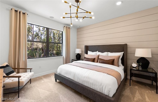 carpeted bedroom featuring a notable chandelier