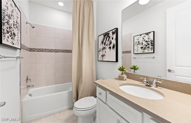 full bathroom featuring vanity, toilet, and shower / bathtub combination with curtain