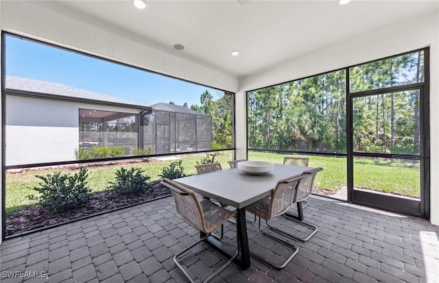 unfurnished sunroom featuring a wealth of natural light