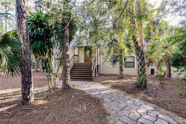 view of property hidden behind natural elements