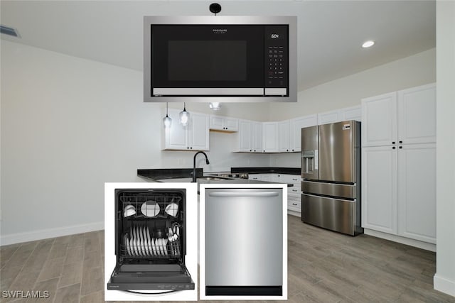 kitchen featuring white cabinetry, sink, wine cooler, light hardwood / wood-style flooring, and stainless steel refrigerator with ice dispenser