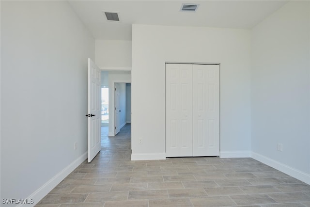 unfurnished bedroom with a closet