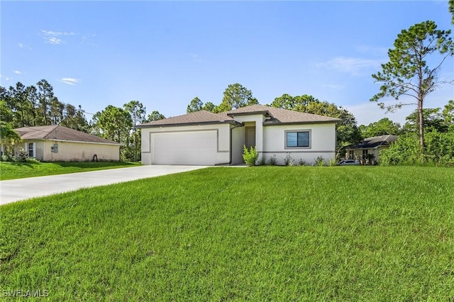 view of front of house with a front yard and a garage