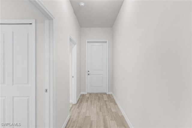 hallway featuring light hardwood / wood-style flooring