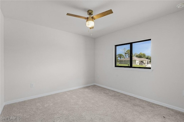 unfurnished room with light carpet and ceiling fan