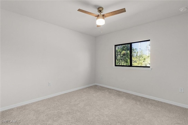 spare room featuring carpet flooring and ceiling fan