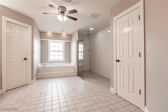 bathroom with tile patterned flooring, independent shower and bath, and ceiling fan