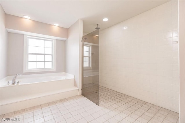 bathroom featuring separate shower and tub and tile patterned flooring