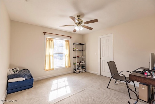 carpeted home office with ceiling fan