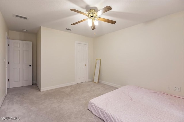 carpeted bedroom featuring ceiling fan