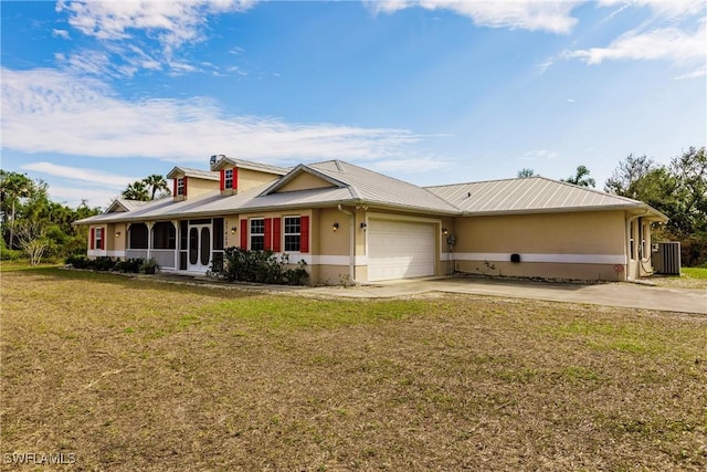 ranch-style house with a front yard, a garage, and cooling unit