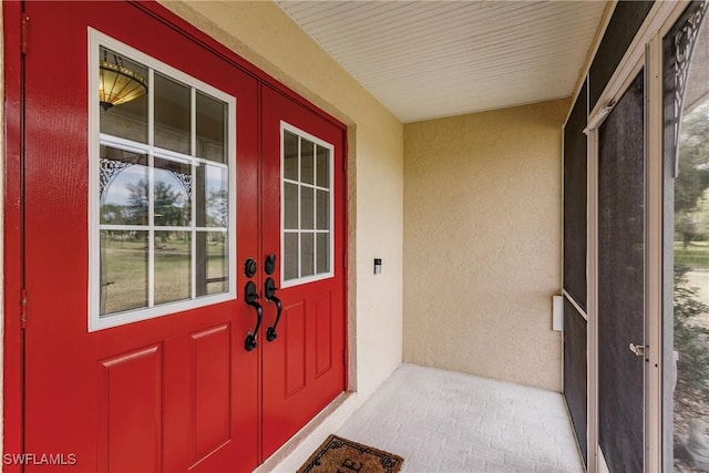 entrance to property featuring french doors