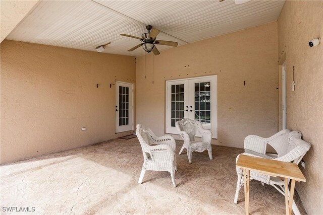 view of patio with french doors and ceiling fan