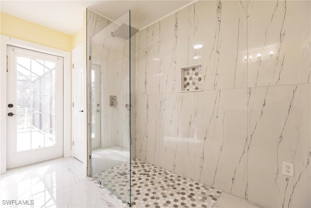 bathroom with a tile shower