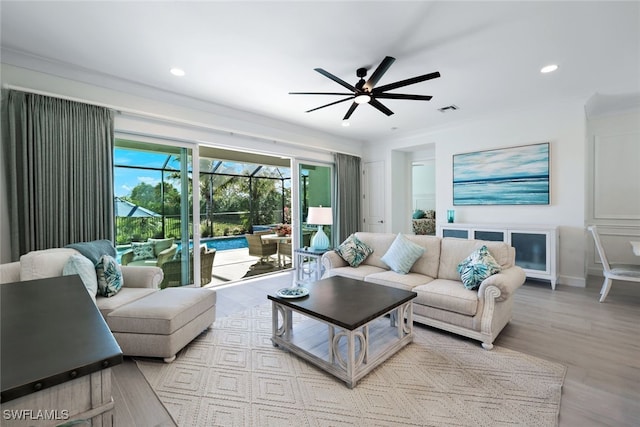 living room with ceiling fan and light wood-type flooring