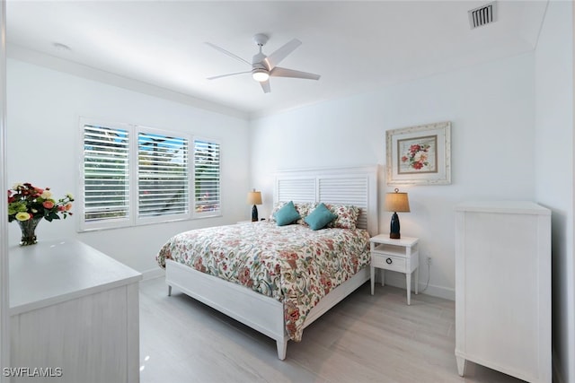 bedroom with ceiling fan and light wood-type flooring