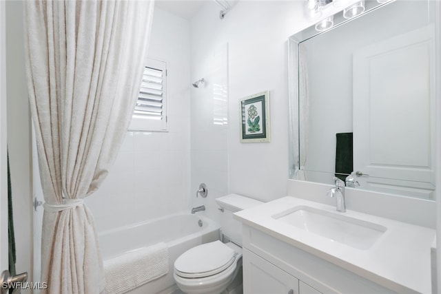 full bathroom featuring vanity, shower / bathing tub combination, and toilet