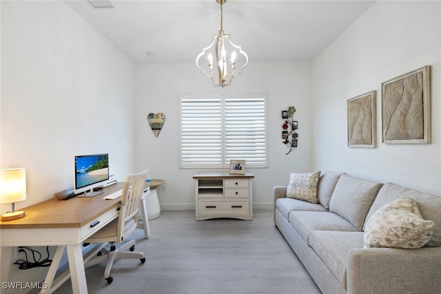 office area featuring a chandelier