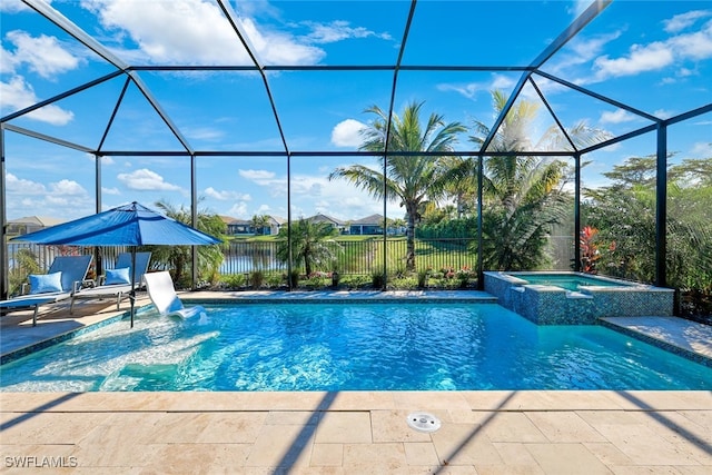 view of swimming pool featuring a lanai, a patio area, an in ground hot tub, and a water view