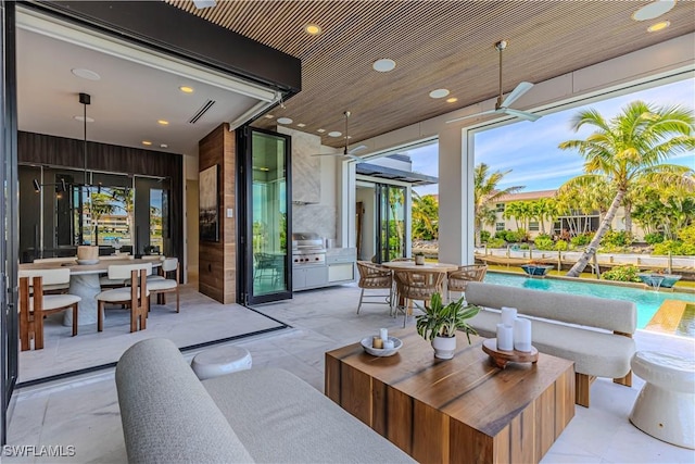 view of patio / terrace featuring area for grilling, a ceiling fan, an outdoor pool, outdoor dining space, and a grill
