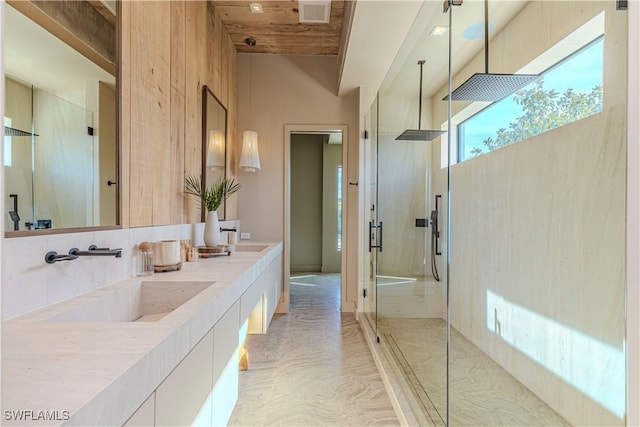 bathroom featuring a stall shower, wood ceiling, double vanity, and a high ceiling