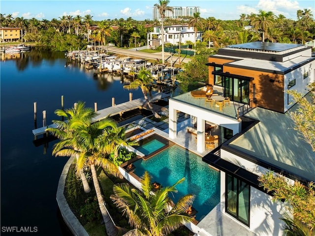 bird's eye view of a nearby body of water and a pool