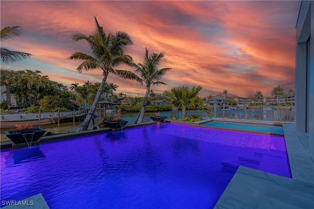 outdoor pool with a water view