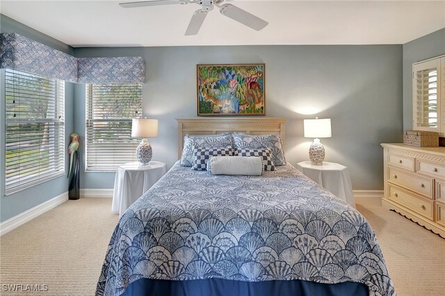 carpeted bedroom with ceiling fan