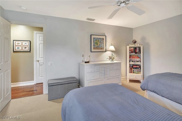 carpeted bedroom featuring ceiling fan