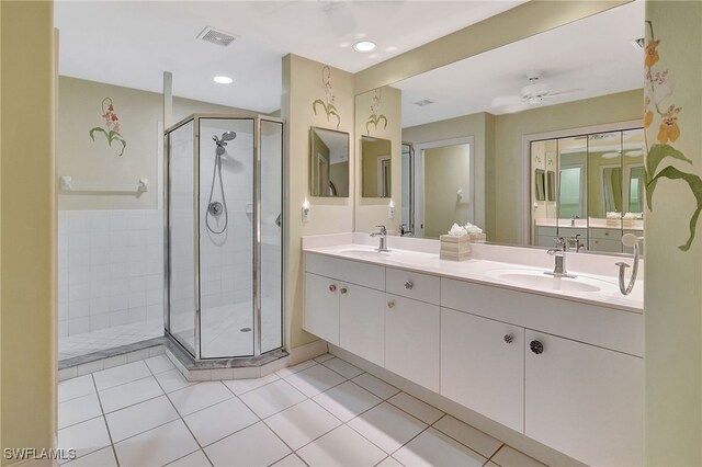 bathroom with tile patterned floors, ceiling fan, an enclosed shower, and vanity