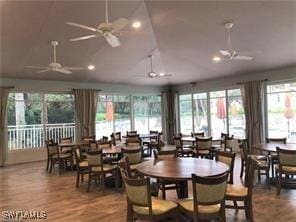 dining room featuring lofted ceiling, recessed lighting, wood finished floors, and ceiling fan