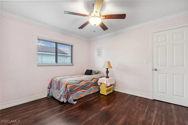 bedroom with ceiling fan, ornamental molding, and dark wood-type flooring