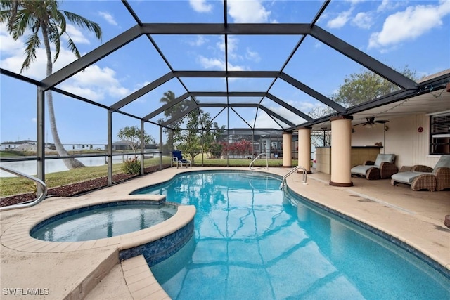 view of pool featuring an in ground hot tub, a water view, a patio area, and a lanai